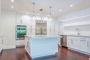 A dream kitchen has marbled quartz counters, high-end stainless appliances